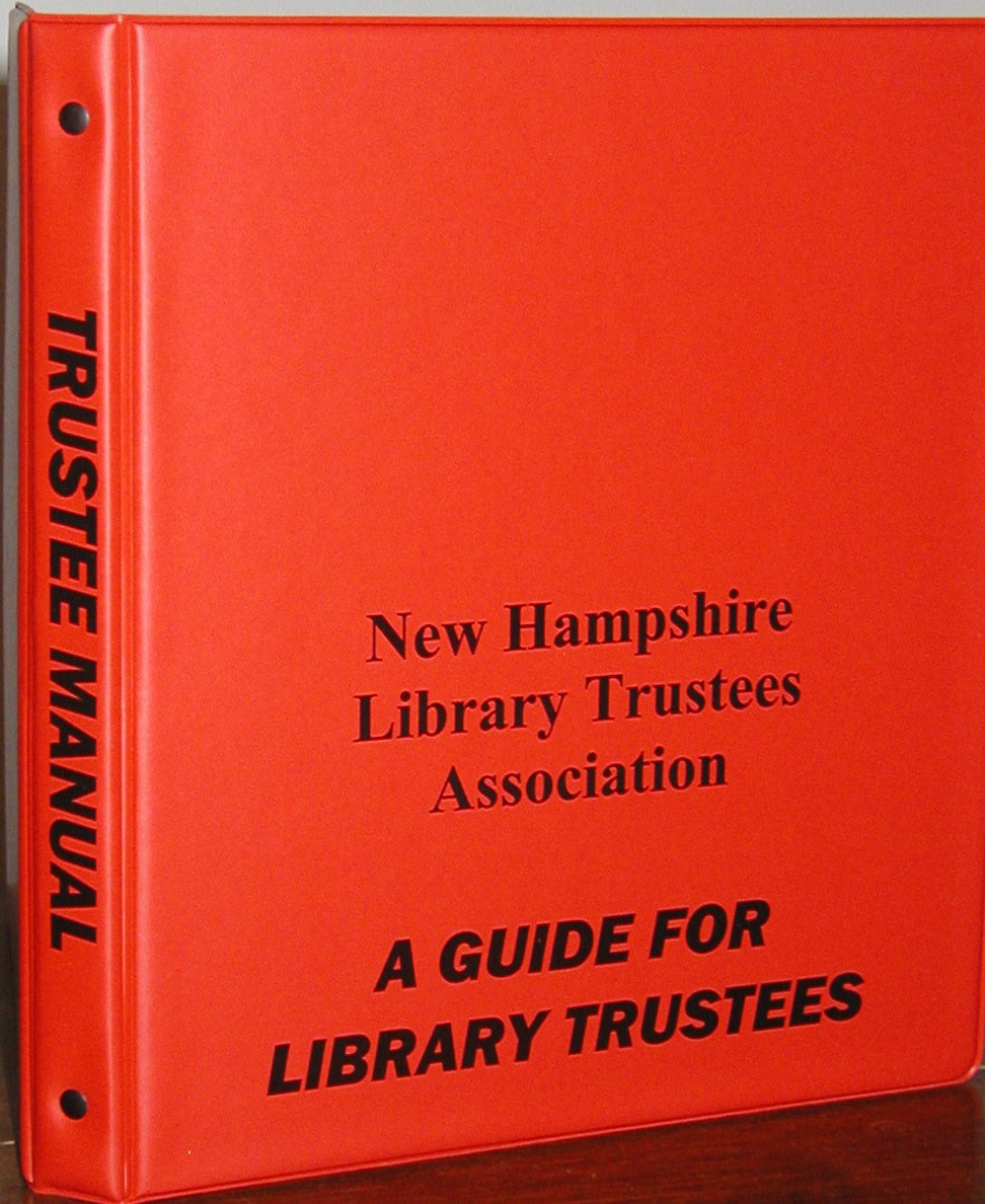 A red binder labeled “TRUSTEE MANUAL” on the spine and “New Hampshire Library Trustees Association: A Guide for Library Trustees” on the cover.