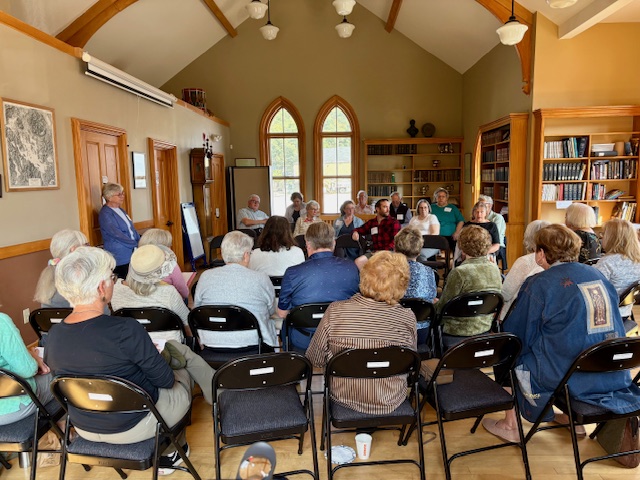 A group of library trustees meeting at the Minot-Sleeper Library in Bristol, NH.